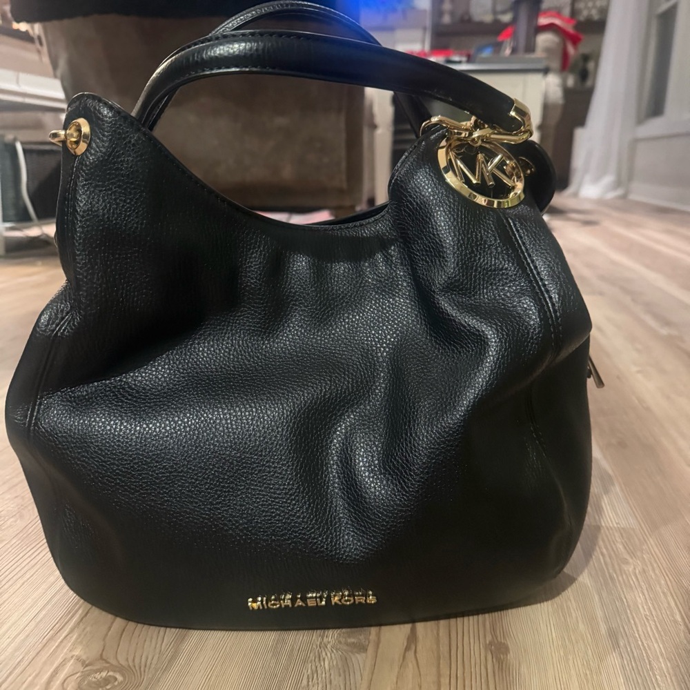 Michael Kors Black Hobo Bag with Gold Accents